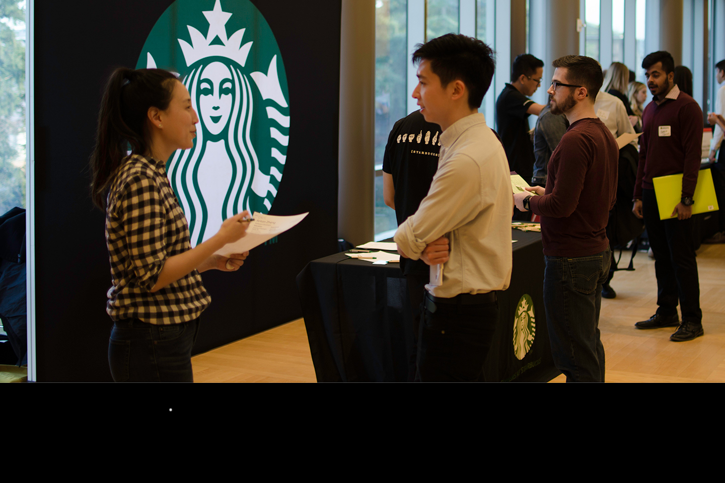 Starbucks representative and student at the iSchool Career Fair