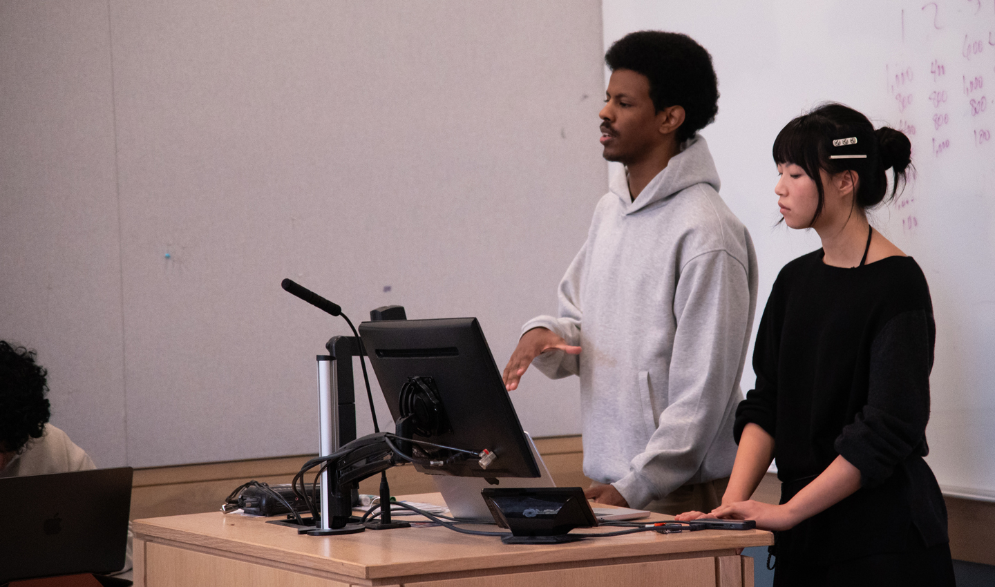 Munir Emam and Jacqueline Flynn present in a classroom.