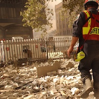 Safety officer walking through a pile of paper debris.
