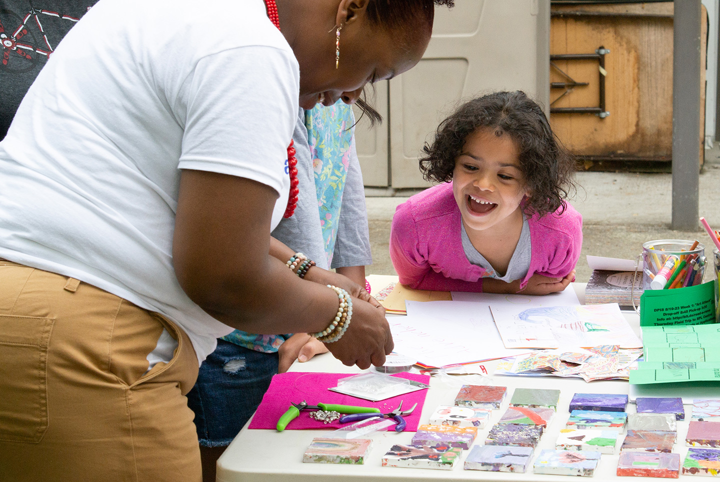 A child plays at a craft table during a 2019 Read-a-Rama camp in Seattle.