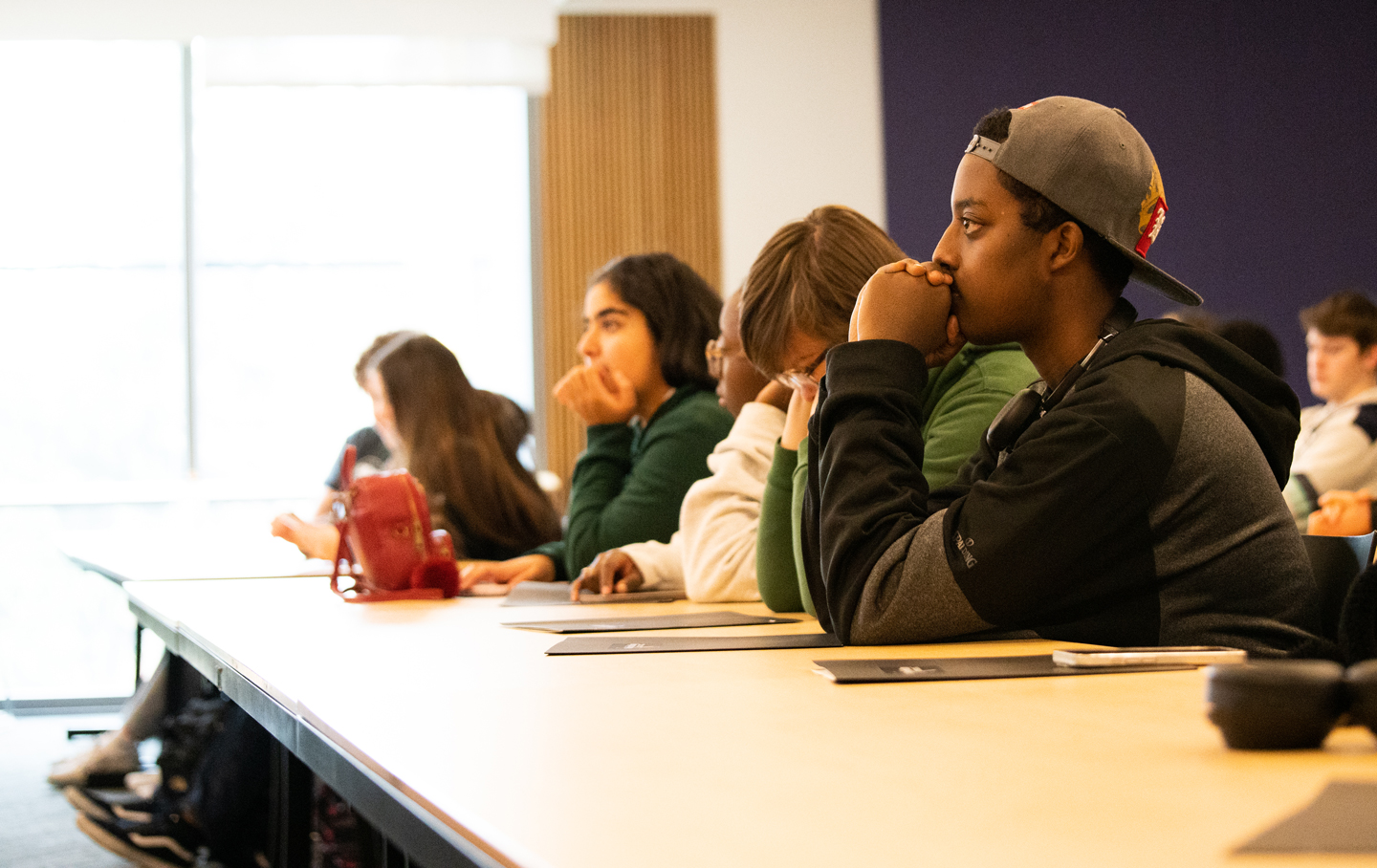 A student watches a presentation.