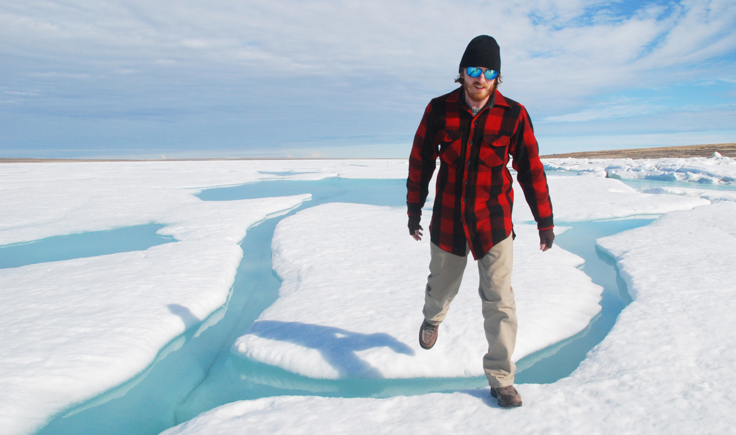 Jason Young walks across ice.
