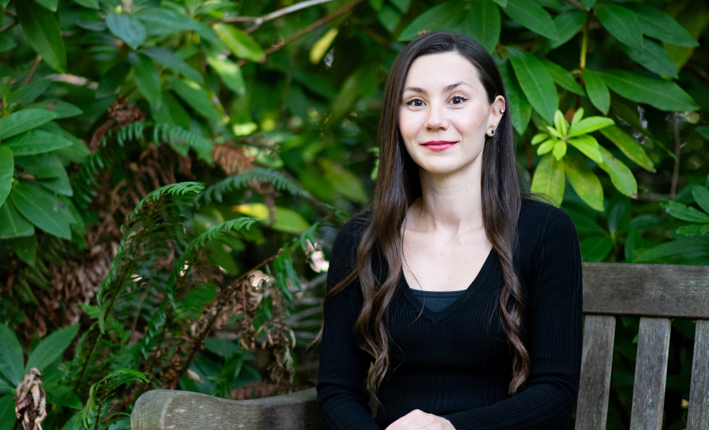 Aylin Caliskan seated on a bench