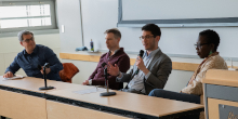 Panelists Noam Pianko, Noah Smith, Ben Lee and Temi Odumosu, seated at a table