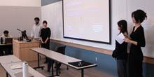 Munir Emam and Jacqueline Flynn, Charlotte Liu and Yuxin (Ellie) Wu present in a classroom.