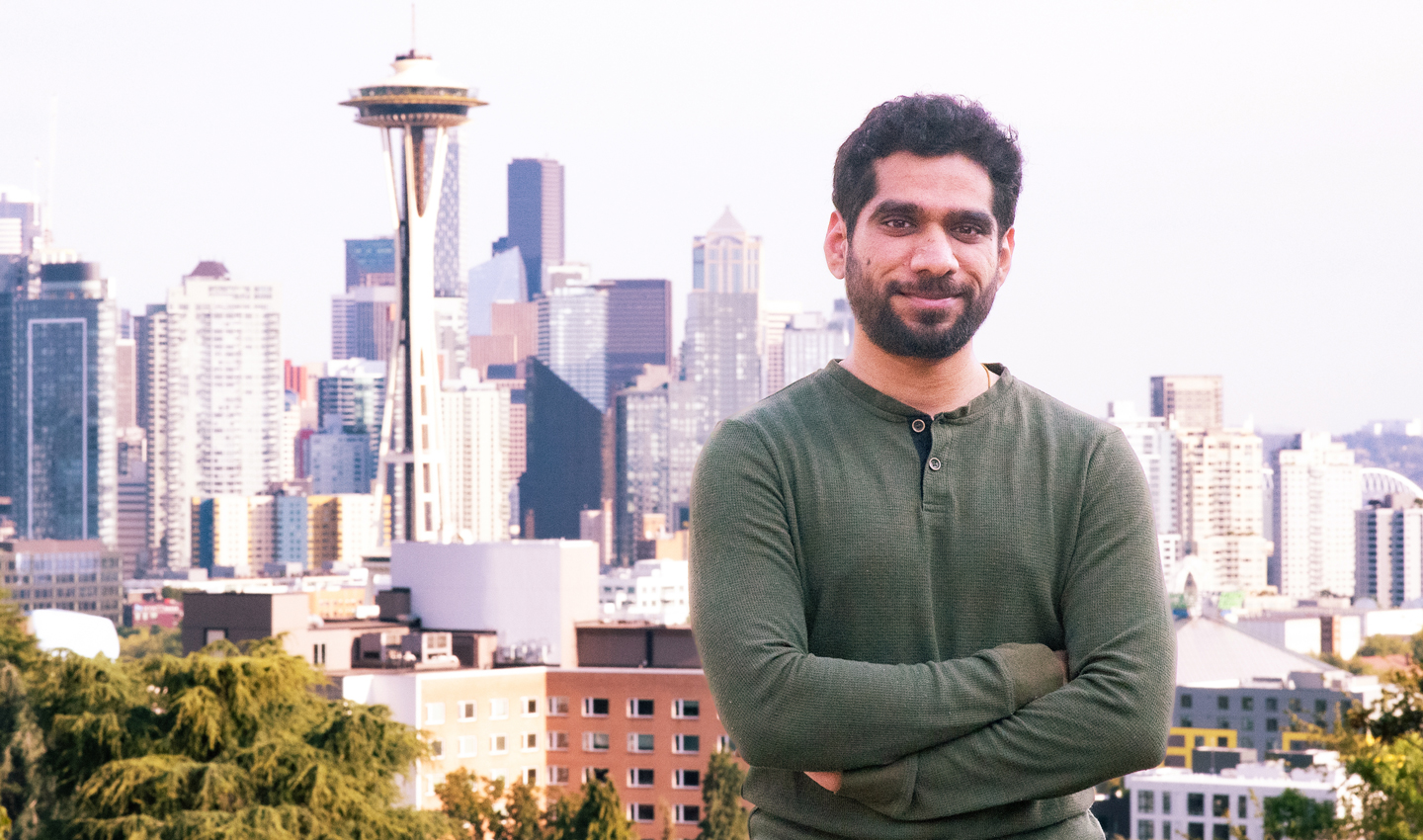 Rahul Zende, with the Seattle skyline behind him.