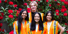Arohee Kumar, Jules Braun, Keilani Uehara and Audrey Phan are pictured wearing orange visibility jackets.