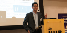 Ben Lee speaks at a lectern.