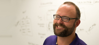 Portrait of Jacob Wobbrock in a classroom