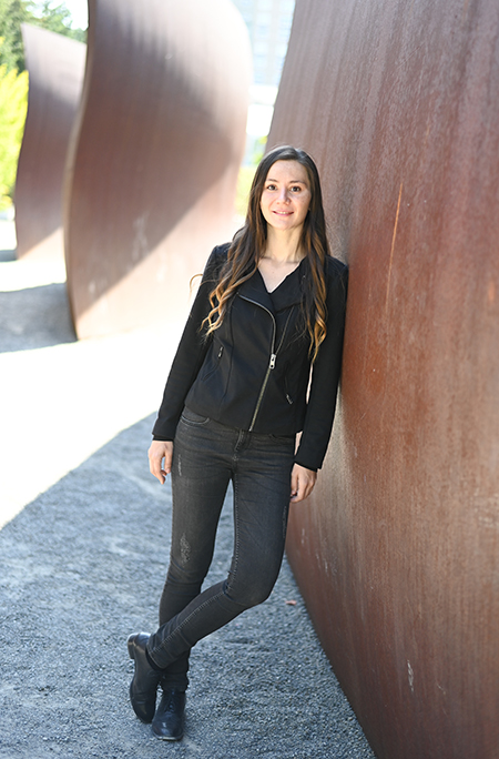 Aylin Caliskan pictured with sculptures at Seattle's Olympic Sculpture Park