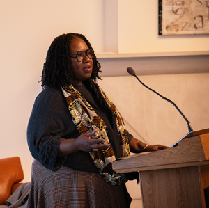 Tracie Hall speaks at a lectern.