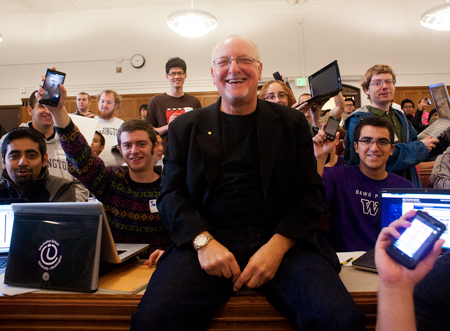 Mike Eisenberg sits among a group of 15-20 students.