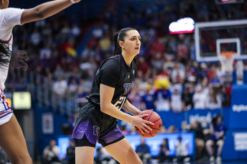 Emma Grothaus holds the basketball while playing in a game for the UW.