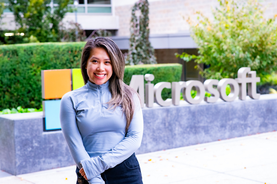 Krystal Liang poses in front of a Microsoft sign outside one of the company's buildings in Redmond.