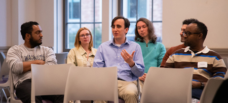 Jack O'Heir speaks as several others listen.