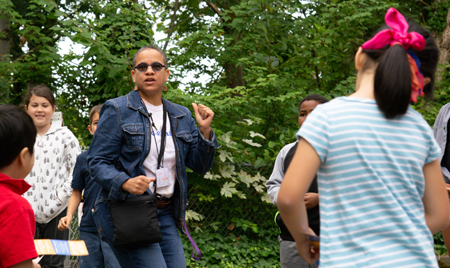Michelle H. Martin dances with children.