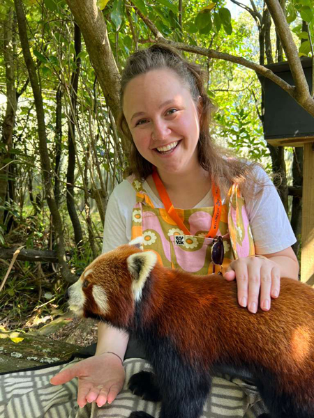 Sophia Ferguson holds a red panda.