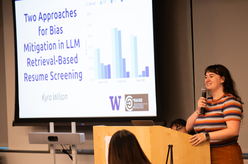 Ph.D. student Kyra Wilson speaks about her research at a lectern.