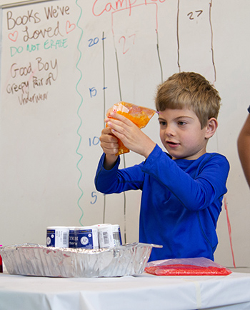 A child plays with crafts at Camp Read-a-Rama Spokane.