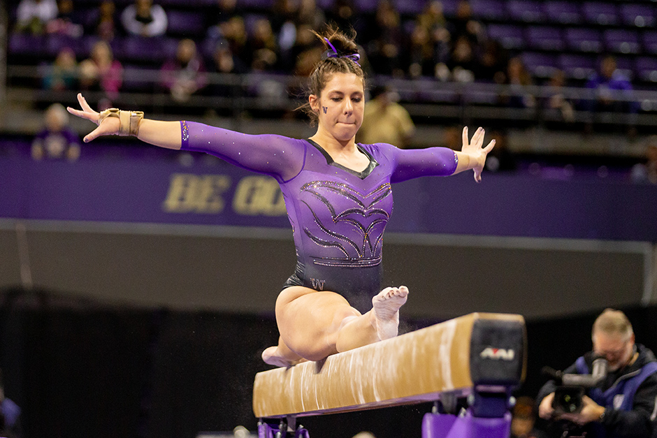 Malory Rose competes on the balance beam.