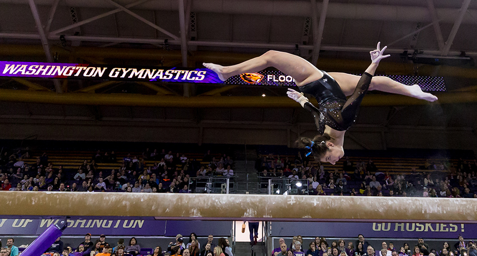 Malory Rose competes on the balance beam.