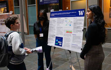 Celestine Le (left) and Nandita Raman present a poster on their research project, “Typology of Five Alt-Tech Platforms’ Policies."