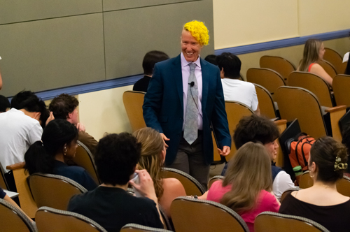 Wes King talks with students during a class.
