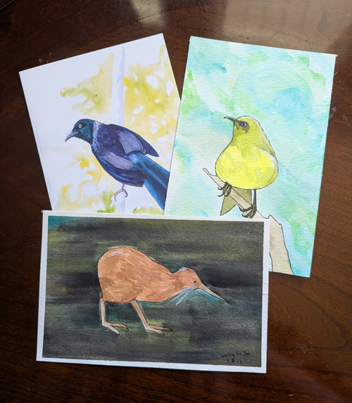 Three watercolor sketches of birds.