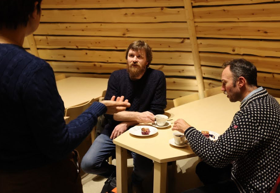 Jason Young speaks with colleagues while visiting the Sámi Education Institute in Inari, Finland.
