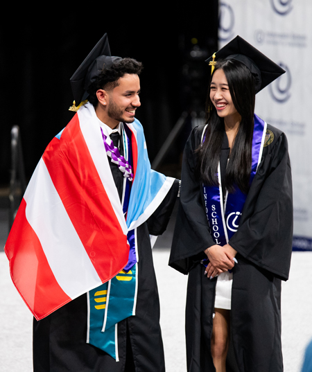 Jonathan Ortiz-Candelaria and Kayla Tounalom on stage during the awards presenation.