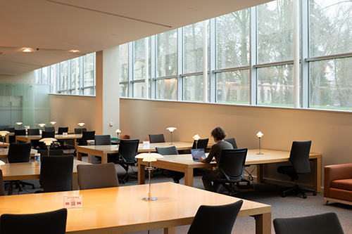 Kristin Glover works alone in the Gallagher Law Library.