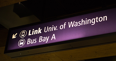 A sign pointing to light rail and buses