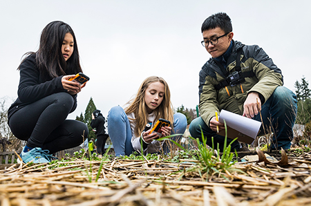 Children try out the NatureCollections app during a field test.