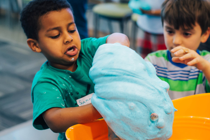 Kids wrangle slime at Read-a-Rama.