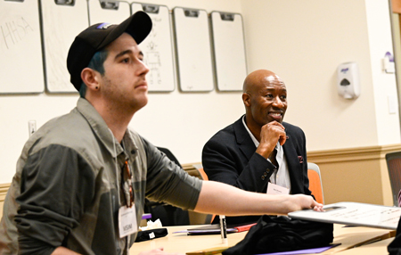 Students work on an activity during a session on setting up a data, analytics and AI strategy.