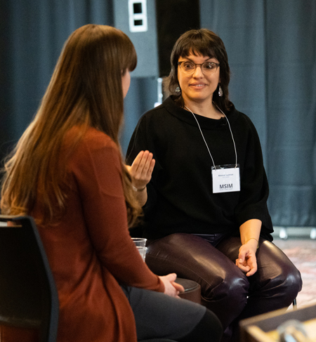 Monica Guzman (right) and Heather Whiteman speak during the opening keynote session on March 17.