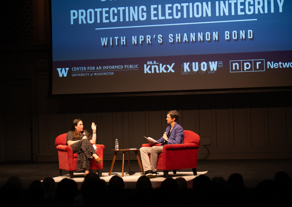 Shannon Bond of NPR and Kate Starbird of the Center for an Informed Public, seated on stage under a screen reading "protecting election integrity with NPR's Shannon Bond."